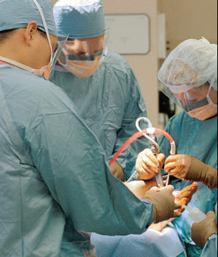 surgeons working on foot